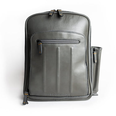 Gray leather backpack front view.