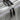 Gray leather duffel bag zipper view
