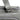 Gray leather duffel bag handle view